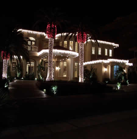 Holiday Illumination team installing Christmas lights on Las Vegas home
